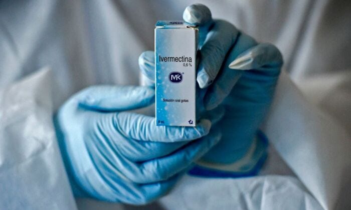 A health worker shows a box containing a bottle of Ivermectin, a medicine authorized by the National Institute for Food and Drug Surveillance to treat patients with mild, asymptomatic or suspicious COVID-19, as part of a study of the Center for Pediatric Infectious Diseases Studies, in Cali, Colombia, on July 21, 2020. (Luis Robayo/AFP via Getty Images)