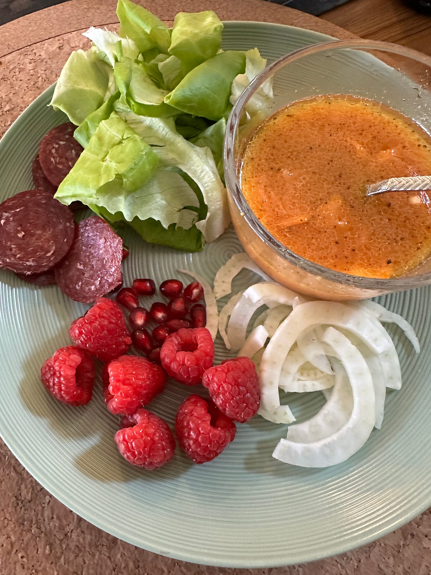 deconstructed salad of fennel, raspberries, pomegranates, beef salami