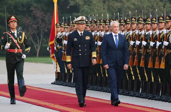 Russian Defense Minister Andrei Belousov and his Chinese counterpart Admiral Dong Jun take part in a ceremony at the Central Military Council building. - Sputnik International