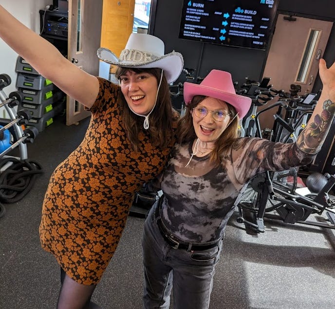 Lauren and Ellen posing in cowboy hats at the line dancing studio in York