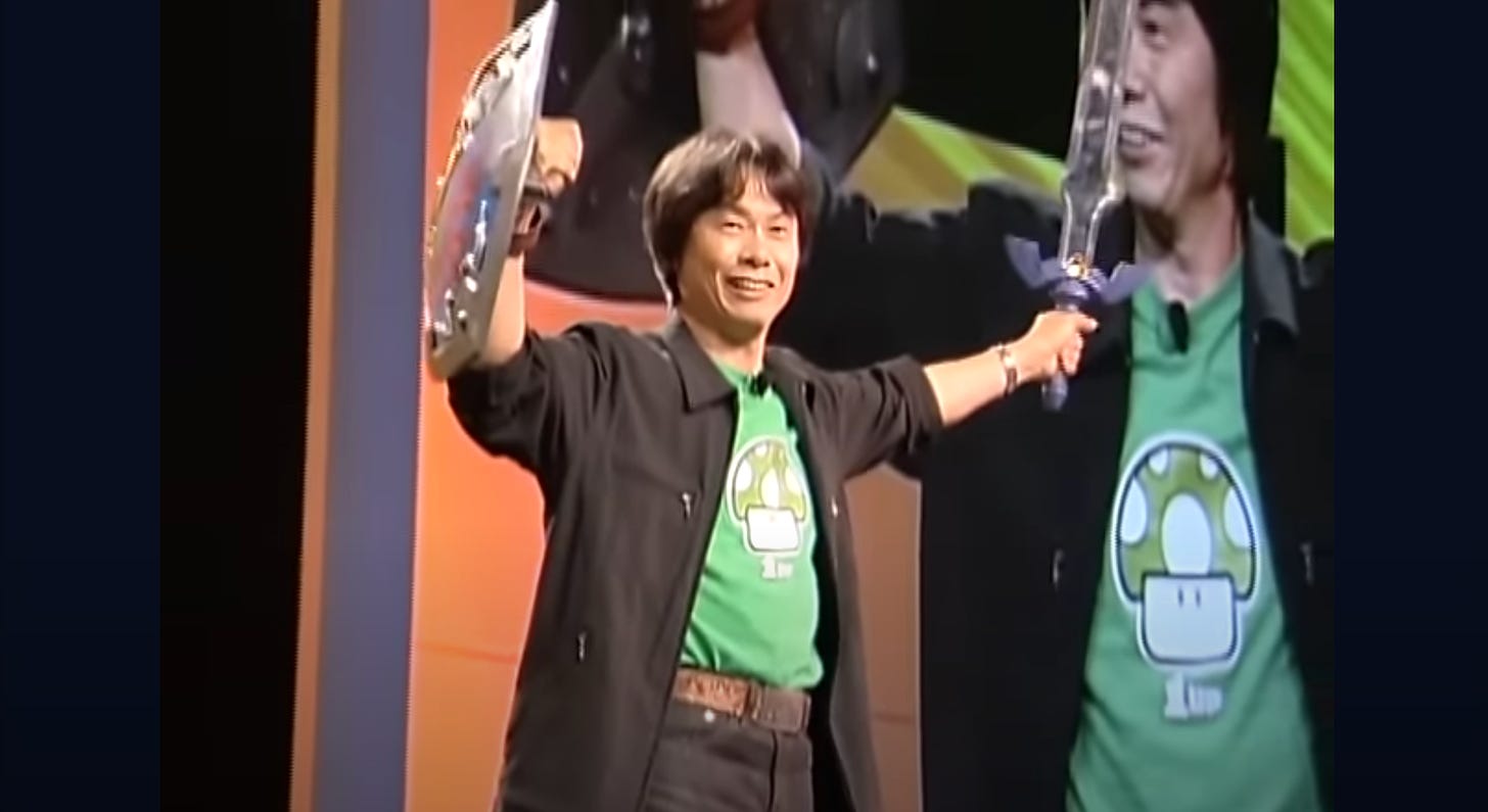 Video stell of a man in a green t-shirt holding a sword and shield