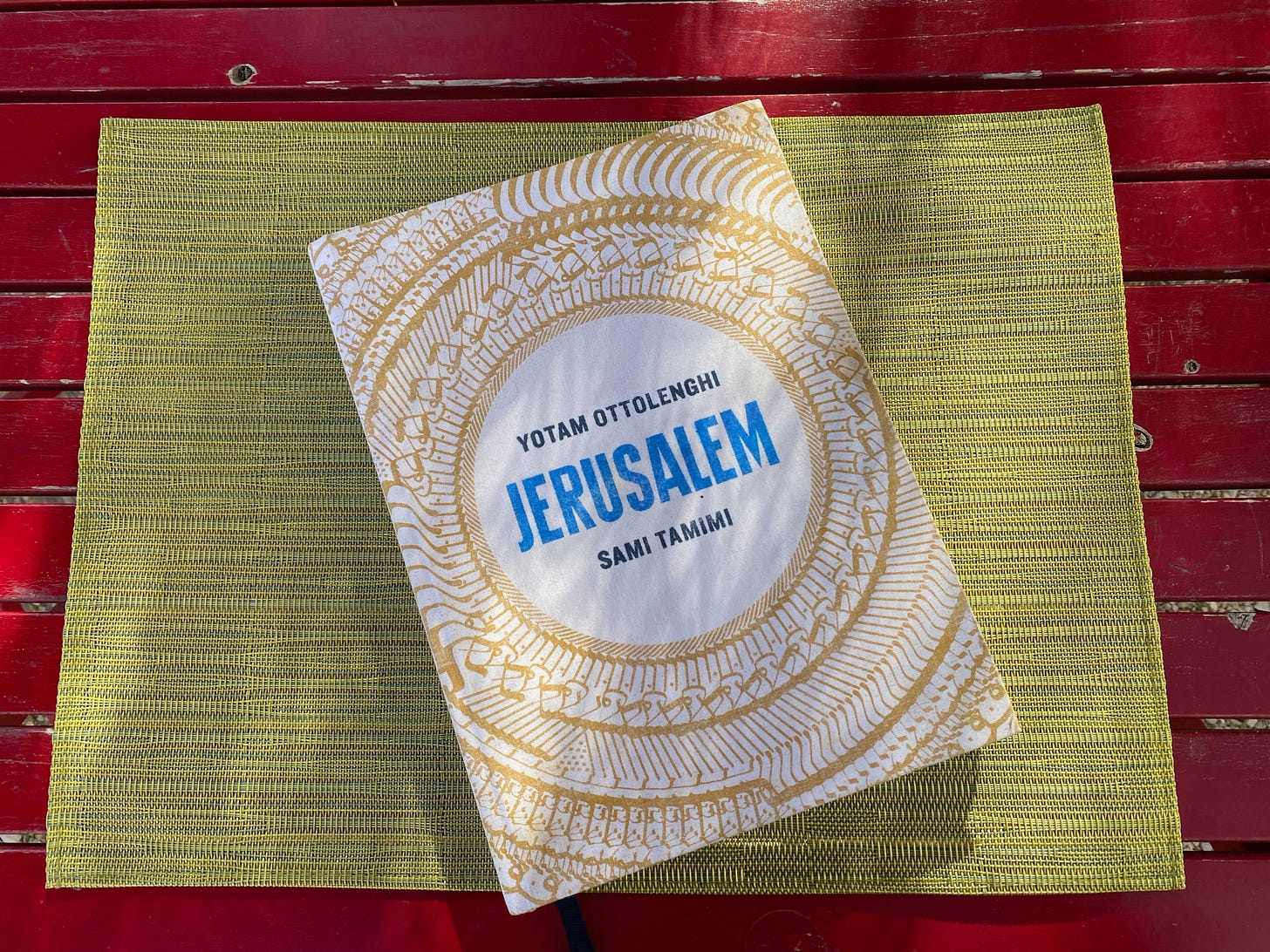 Picture of the cook book - Jerusalem by Yotam Ottolenghi and Sami Tamimi on an outside table.