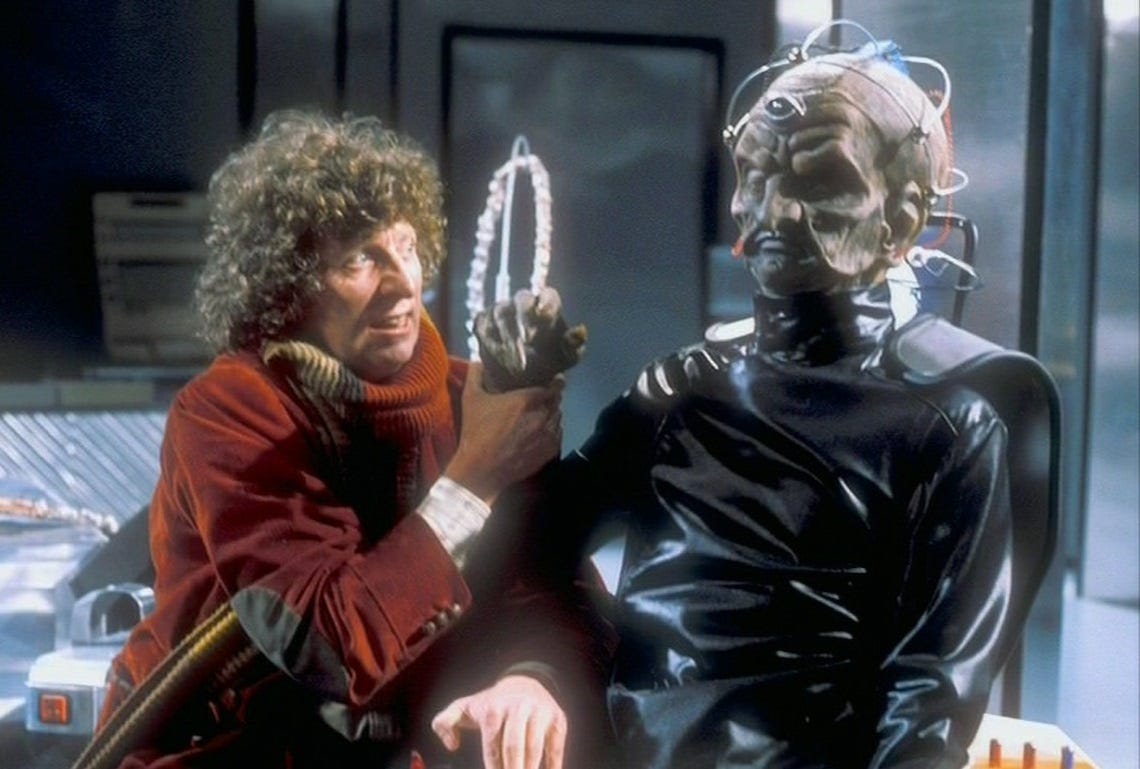 Davros (Michael Wisher) with the fourth Doctor (Tom Baker) in Genesis of the Daleks (1975)