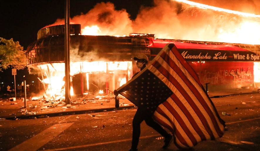 Michael Moore hails 'good citizens burning down the evil police precinct'  in Minneapolis - Washington Times