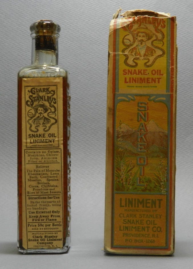 A bottle of Clark Stanley's Snake Oil Liniment, together with outer packaging box, from the Nickell Snake Oil Collection.