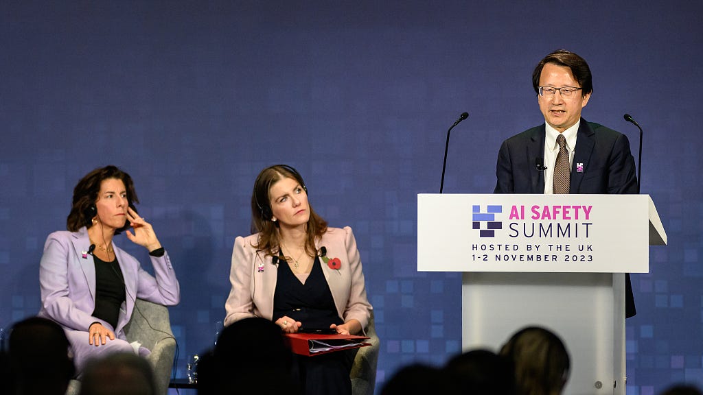 China's vice minister of science and technology Wu Zhaohui (R), speaks at the AI Safety Summit at Bletchley Park, and U.S. Secretary of Commerce Gina Raimondo (L) and British Secretary of State for Science Innovation and Technology Michelle Donelan (C) listen to Wu's speech in Bletchley, Britain, November 1, 2023. /CFP