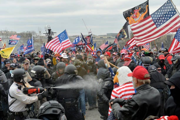 Trump supporters clash with police and security forces as people try to storm the US Capitol Building in Washington, DC, on January 6, 2021....