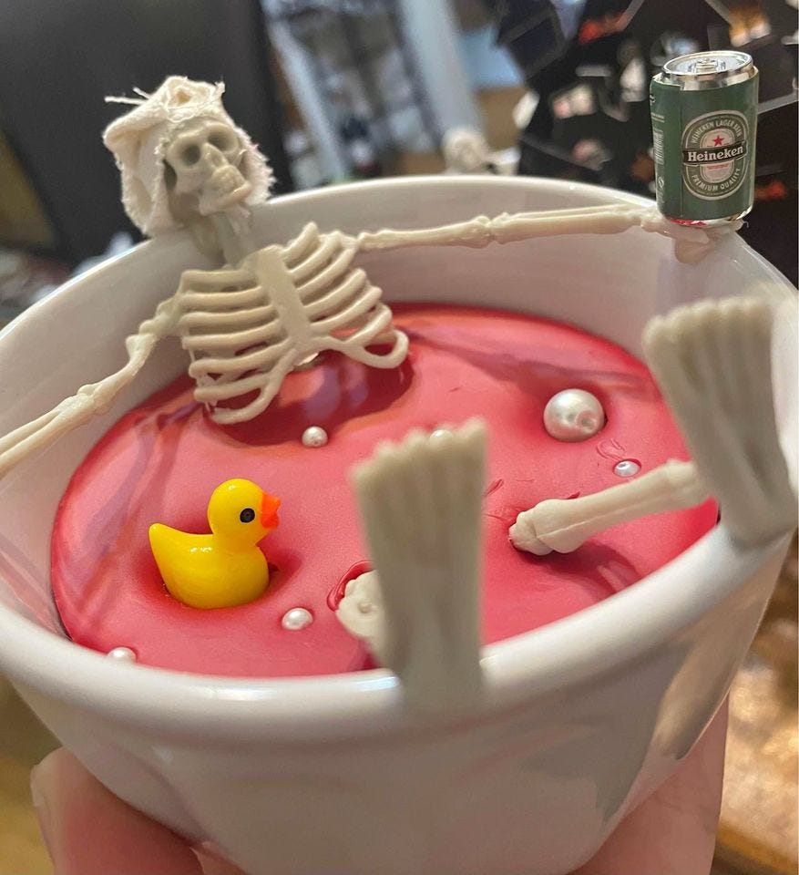 Product photo of Skelly with a Heineken ￼and rubber duck