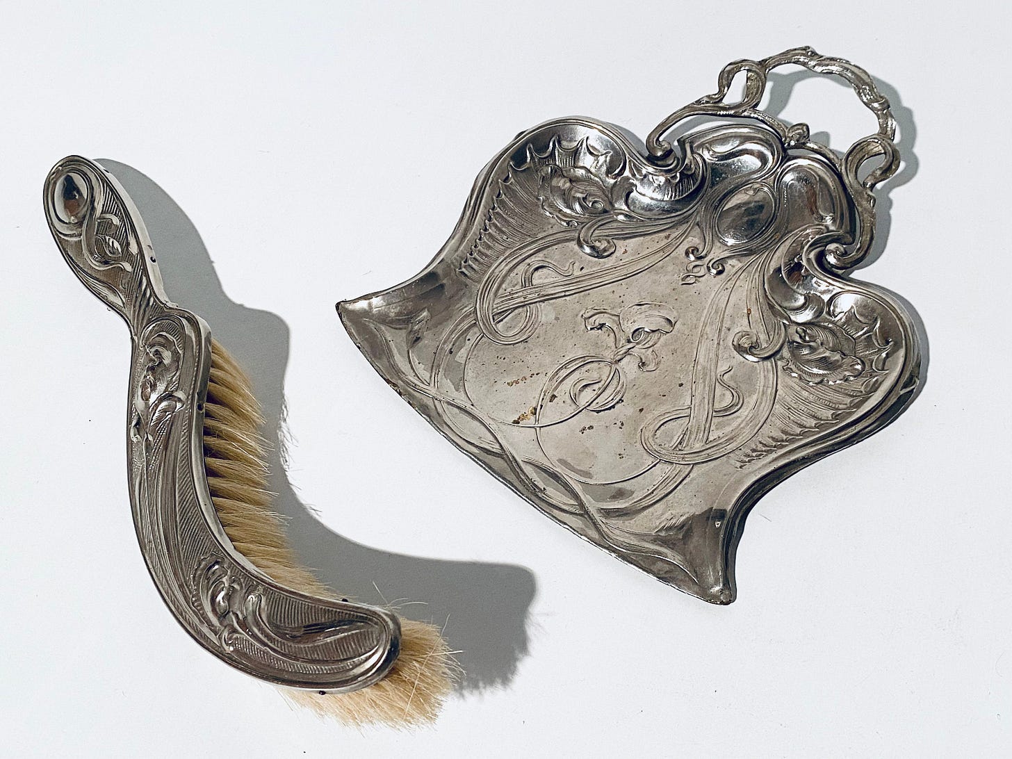 Example of a Victorian style table brush and pan set