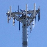 Small photo of a tower with a triangular array of elctronics atop it