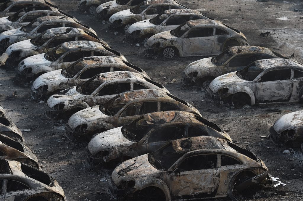 Explosion in Chinese City of Tianjin Burns Dozens of VW Beetles and Hundreds of Other Cars ...