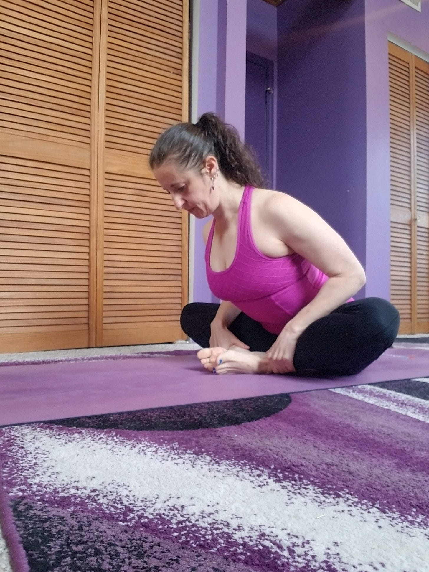 A demonstration of Baddha Konasana, or Bound Angle pose