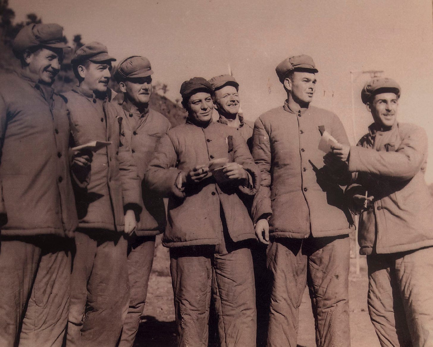 Several American prisoners of war at a Korean POW camp