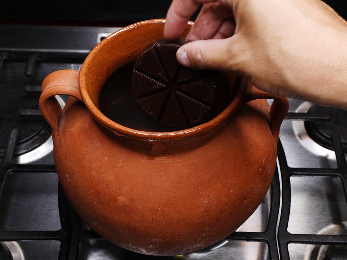 adding Mexican chocolate tablet to pot