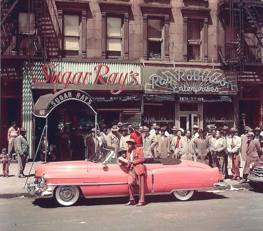 Boxing History on Twitter: ""Sugar" Ray Robinson leans on his pink Cadillac  in front of his businesses in Harlem. At one point, Robinson had the Robin  Crest Sporting Club, Sugar Ray's Cafe,