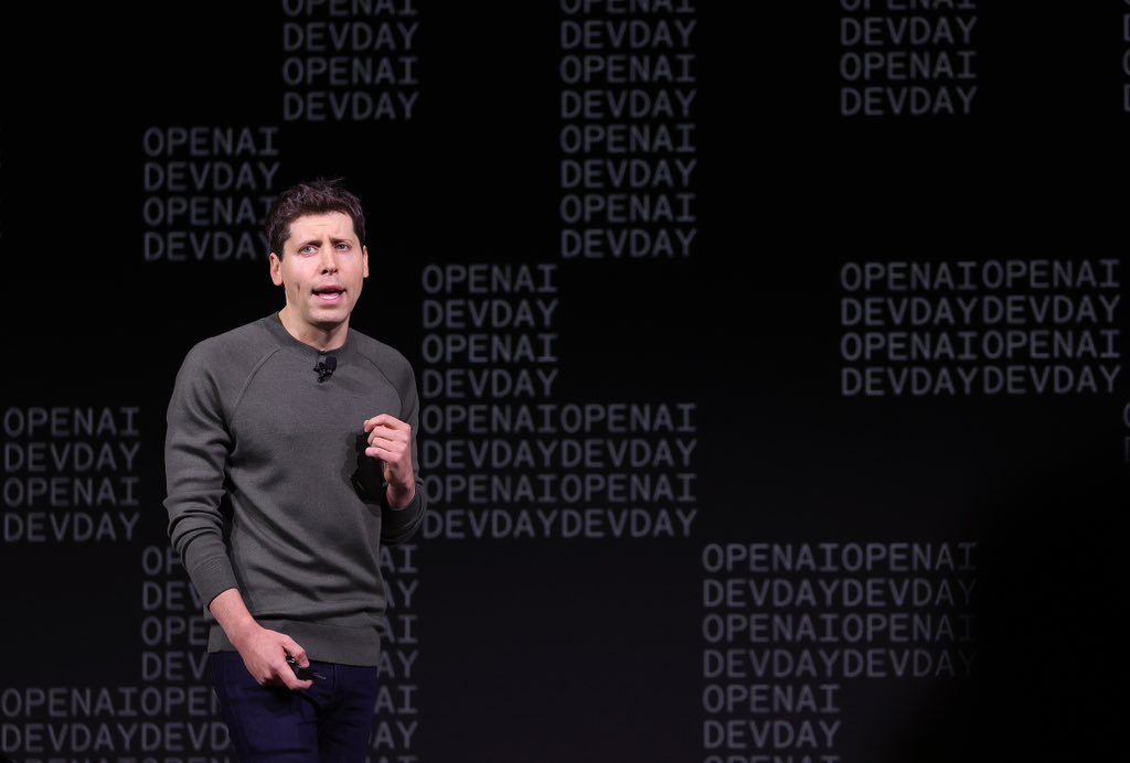 Sam Altman presenting on-stage at OpenAI DevDay two weeks ago.