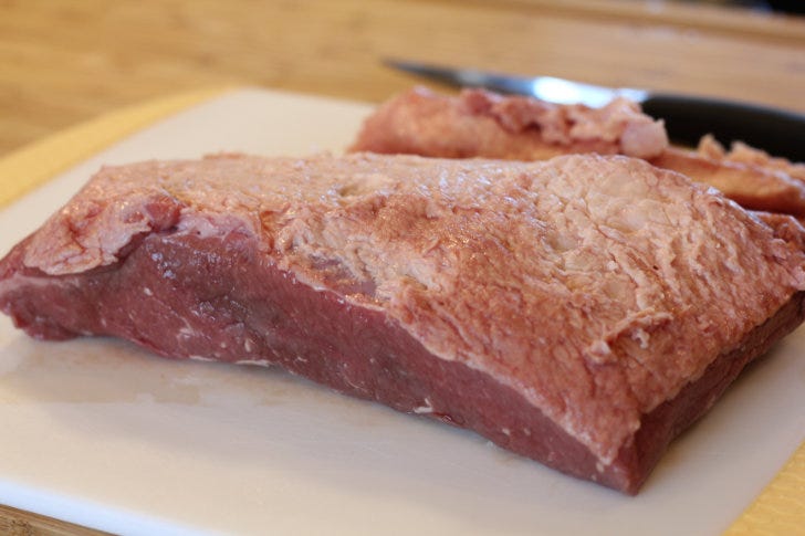 Trim any excess fat (known as the fat cap) from the brisket (if necessary) to prepare it for brining. Set the meat aside until needed.