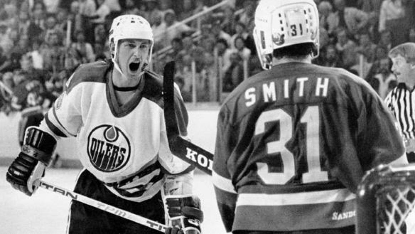 Wayne Gretzky exchanges words with Billy Smith, 1983 : r/sports
