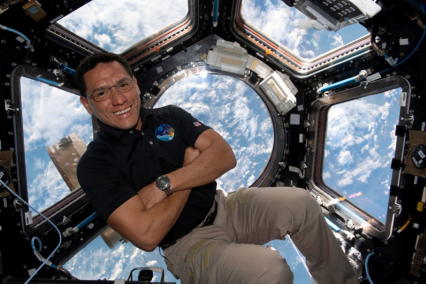 This image provided by NASA shows astronaut Frank Rubio floating inside the cupola, the International Space Station’s “window to the world.”