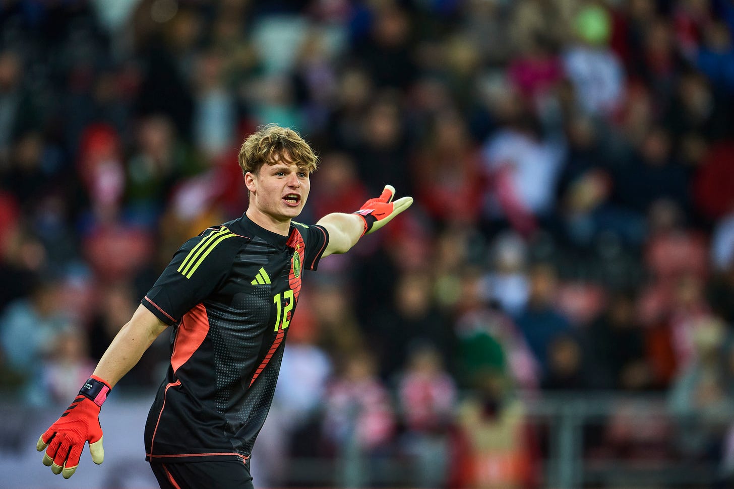 Jonas Urbig gestures during the UEFA European Under-21 Championship 2025 qualifier match between Poland and Germany at Stadion Miejski Lodz.