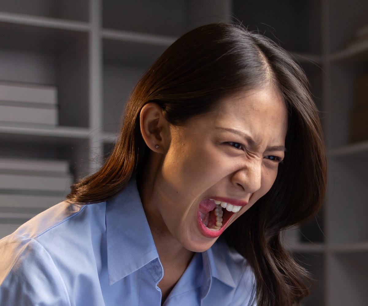 Asian woman screaming, angry