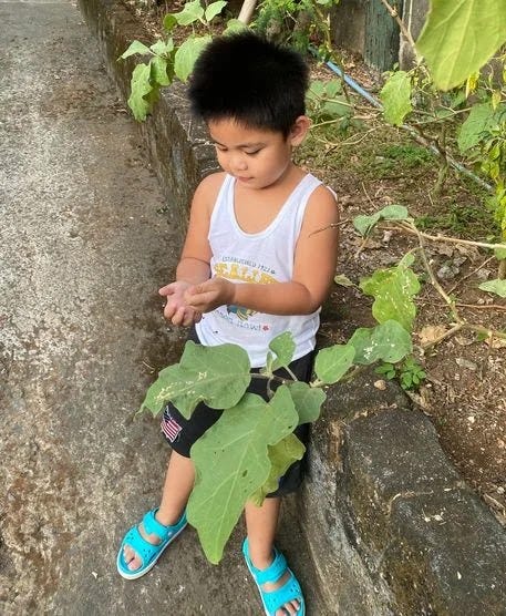 Miguel playing in the garden