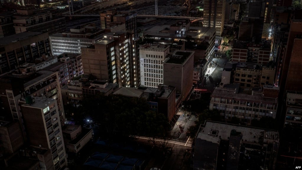 FILE - A general view of some parts of the Braamfontein area of Johannesburg, South Africa, submerged in darkness because of a load-shedding rolling blackout on Jan. 31, 2023. 