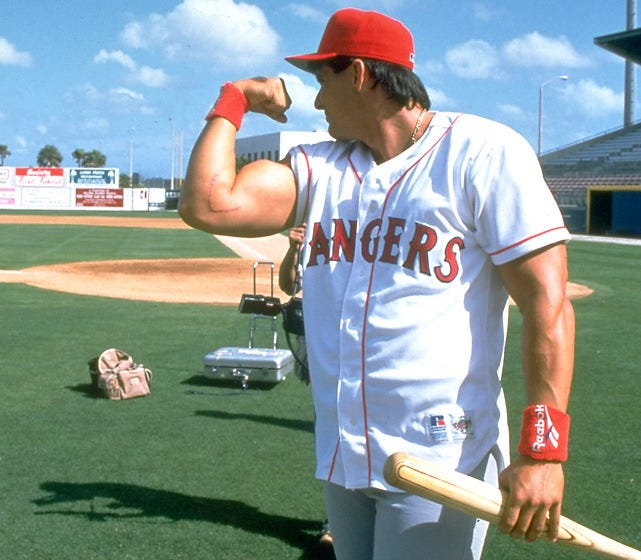 SI Photo Blog — Rangers outfielder Jose Canseco flexes his muscle...