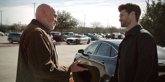 Bonham talks with gay son LIam outside Side Step bar on Walker.