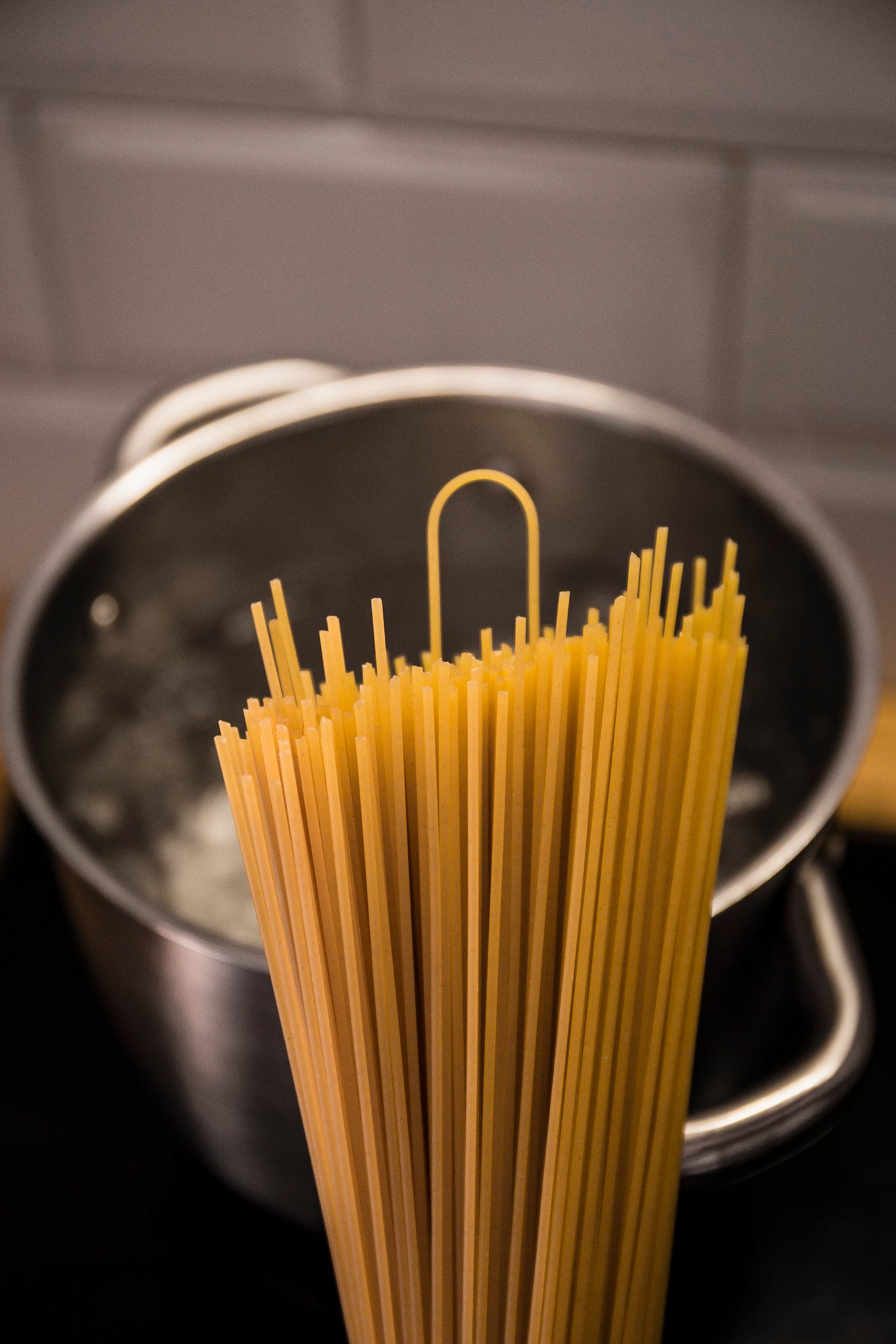 yellow pasta on stainless steel bowl pre-cooking | Optimal Cooking Time for Perfectly Separated Pasta Strands yellow pasta on stainless steel bowl pre-cooking | Optimal Cooking Time for Perfectly Separated Pasta Strands