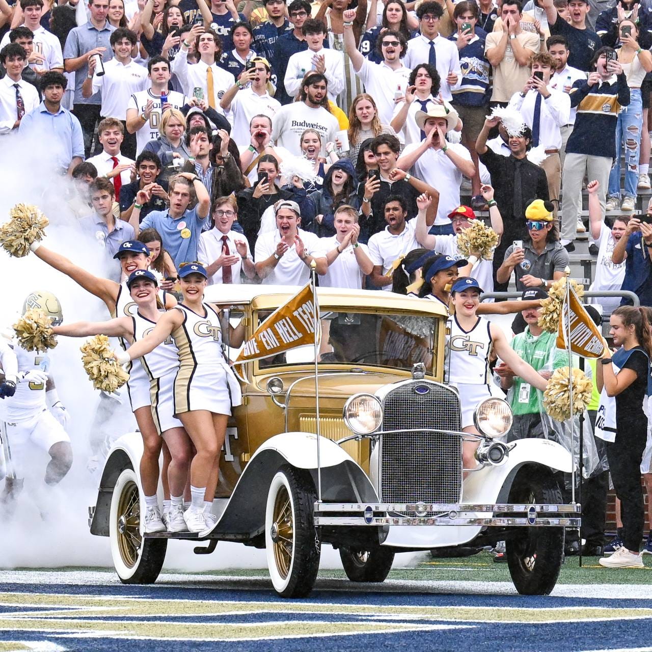Georgia Tech’s cheer squad leads football players onto the field in September. Georgia Tech’s cheer squad leads football players onto the field in September.
