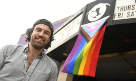 Darren Shelton, executive director of Planet Ant Theatre, came to work on his day off so that he could hang this LGBTQ+ flag in Hamtramck, Michigan, on Tuesday.