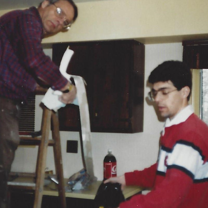 Young man and his father-in-law tackling a minor kitchen remodeling project