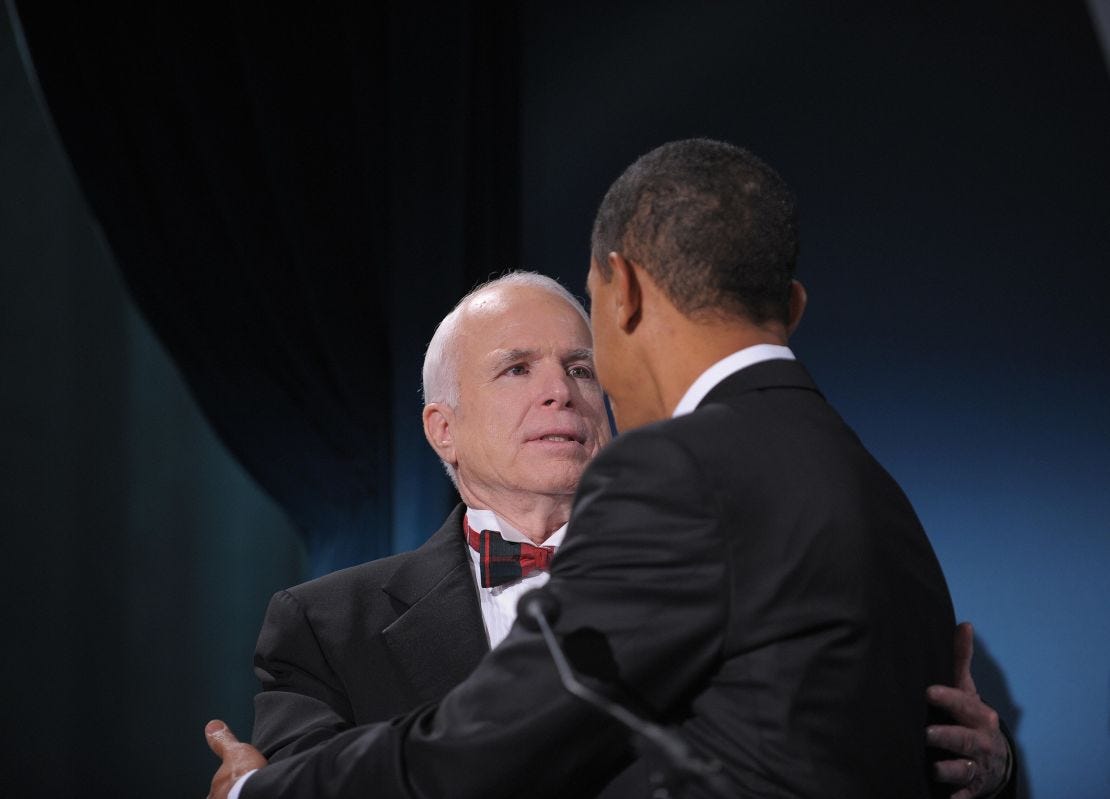 US President-elect Barack Obama greets Arizona Senator John McCain, the former Republican presidential candidate, during a bipartisan dinner in McCain�s honour January 19, 2009 in Washington, DC, on the night before Obama's inauguration as the 44th US President.    AFP PHOTO / Mandel NGAN (Photo credit should read MANDEL NGAN/AFP via Getty Images)
