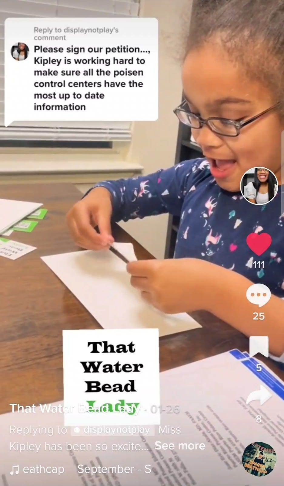 Screenshot of a TikTok of Kipley putting an address label on a letter to Poison Control.