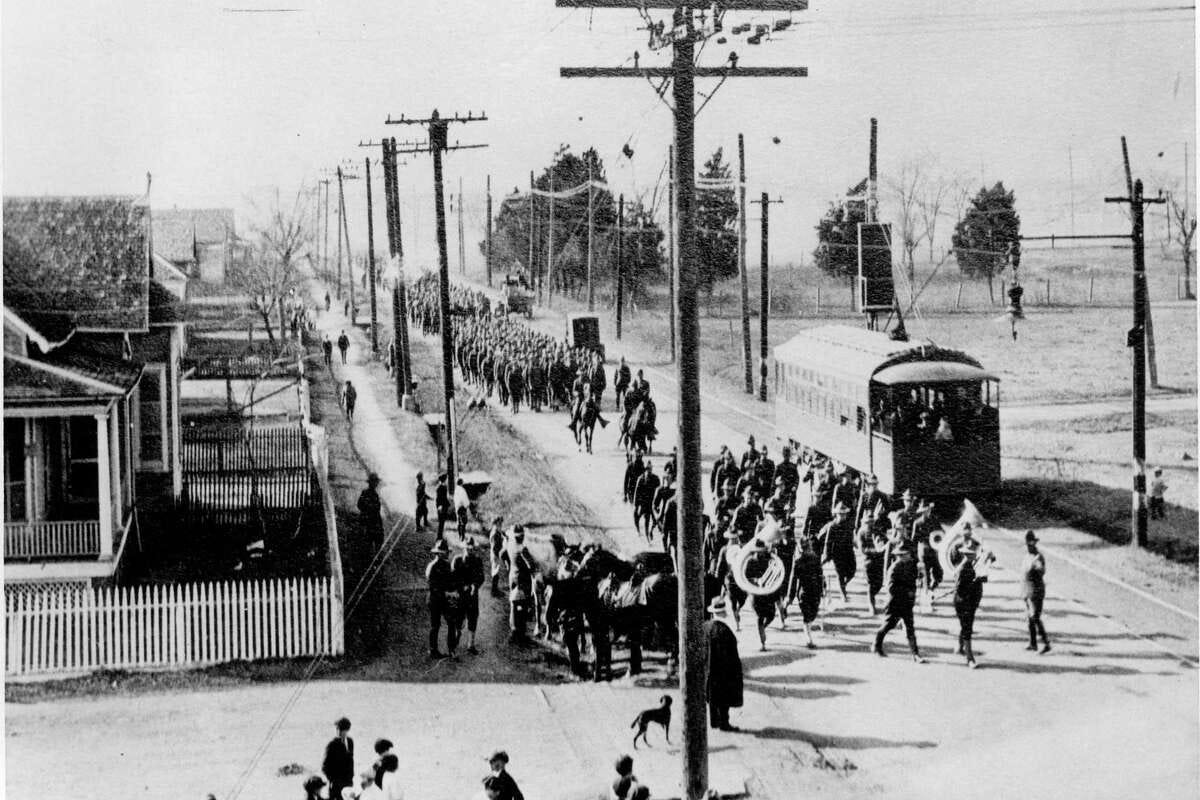 1917 PHOTO BY VICK GOULD. COURTESY GEORGE FUERMANN HOUSTON HISTORICAL COLLECTION. Soldiers marching from Camp Logan to a tabernacle on Vida Street, now Waugh Drive. Camp Logan was located at the present site of Memorial Park. cable car on Vida Street.