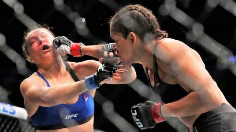 ronda rousey takes hit from amanda nunes