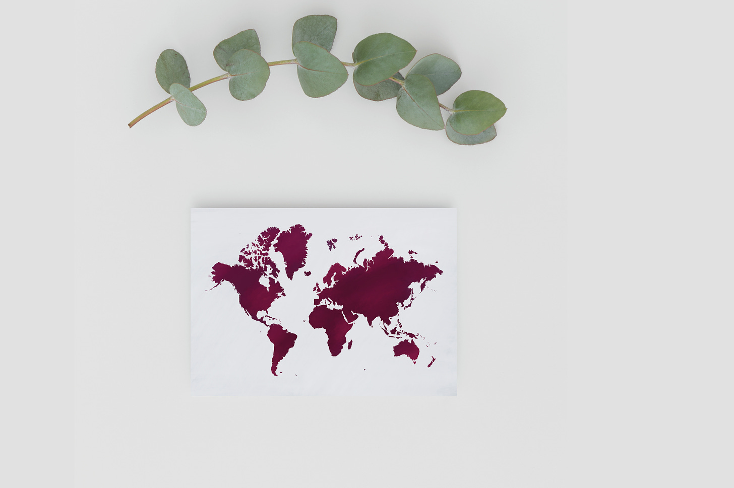 There's more of us fighting for a peaceful world. Art postcard of a world map illustrated in dark red. 
