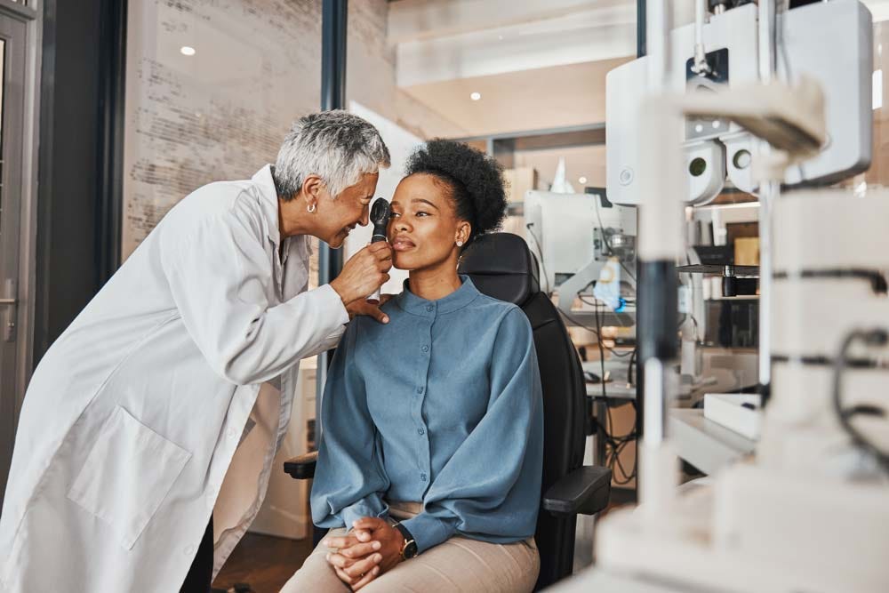 Elder doctor examining her patient during a check-up.