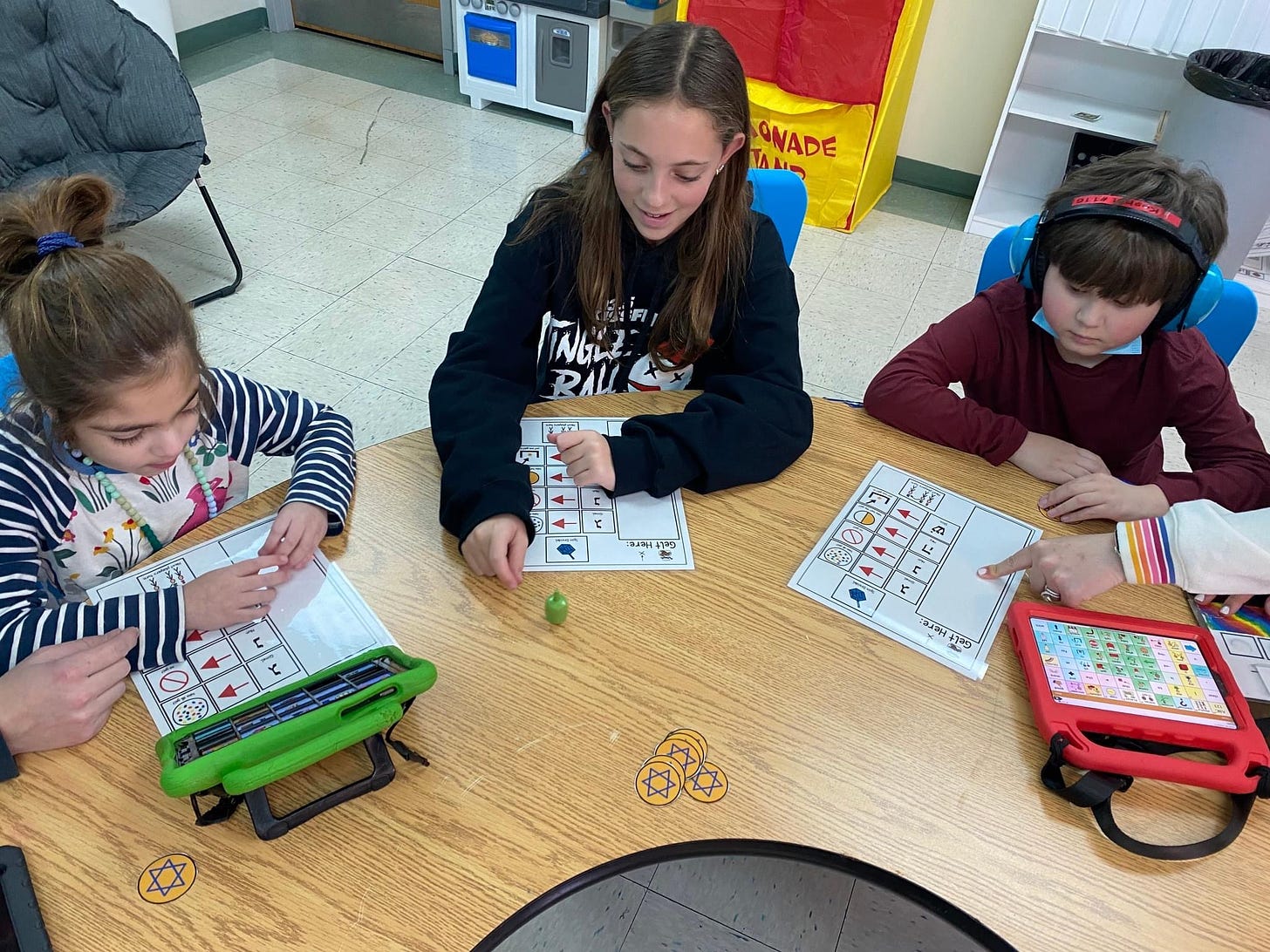 children playing dreidel