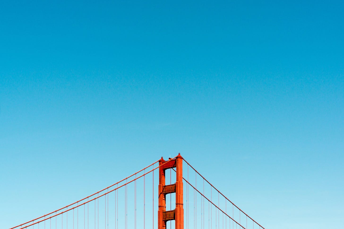 The top of San Francisco's Golden Gate Bridge on a sunny day The top of San Francisco's Golden Gate Bridge on a sunny day