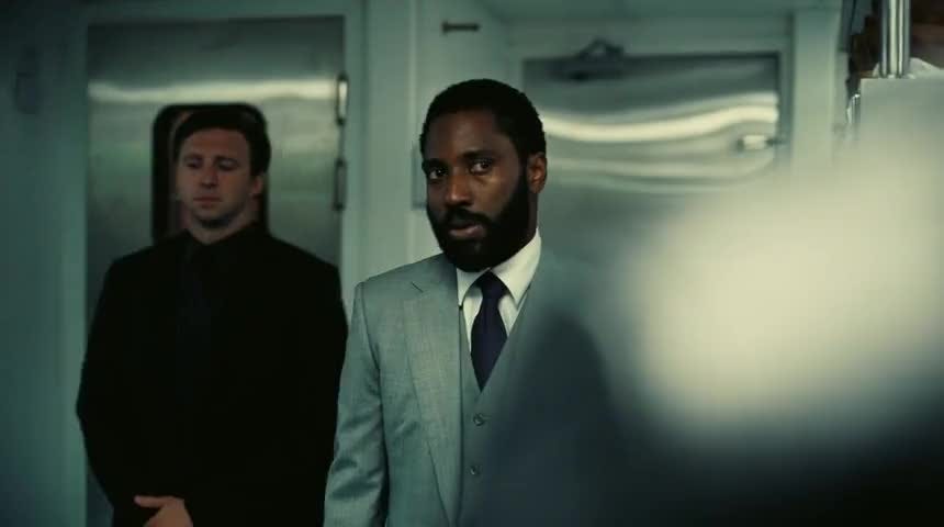 John David Washington in Tenet (there's also another guy standing behind him).