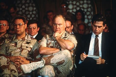 Paul D. Wolfowitz, under secretary of defense for policy, right, takes ...