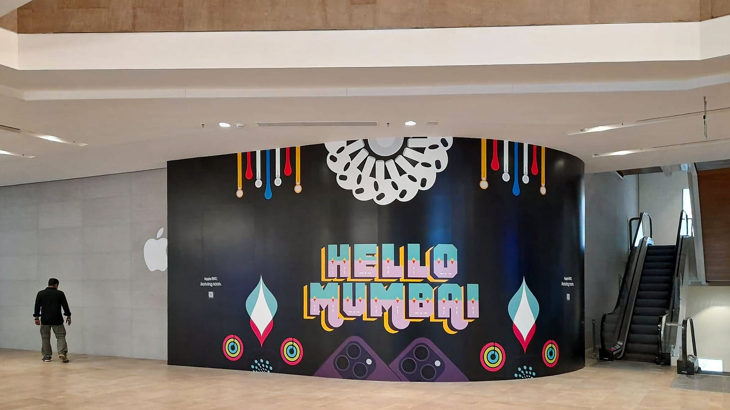 A "Hello Mumbai" banner at Apple BKC inside the Jio World Drive Mall.