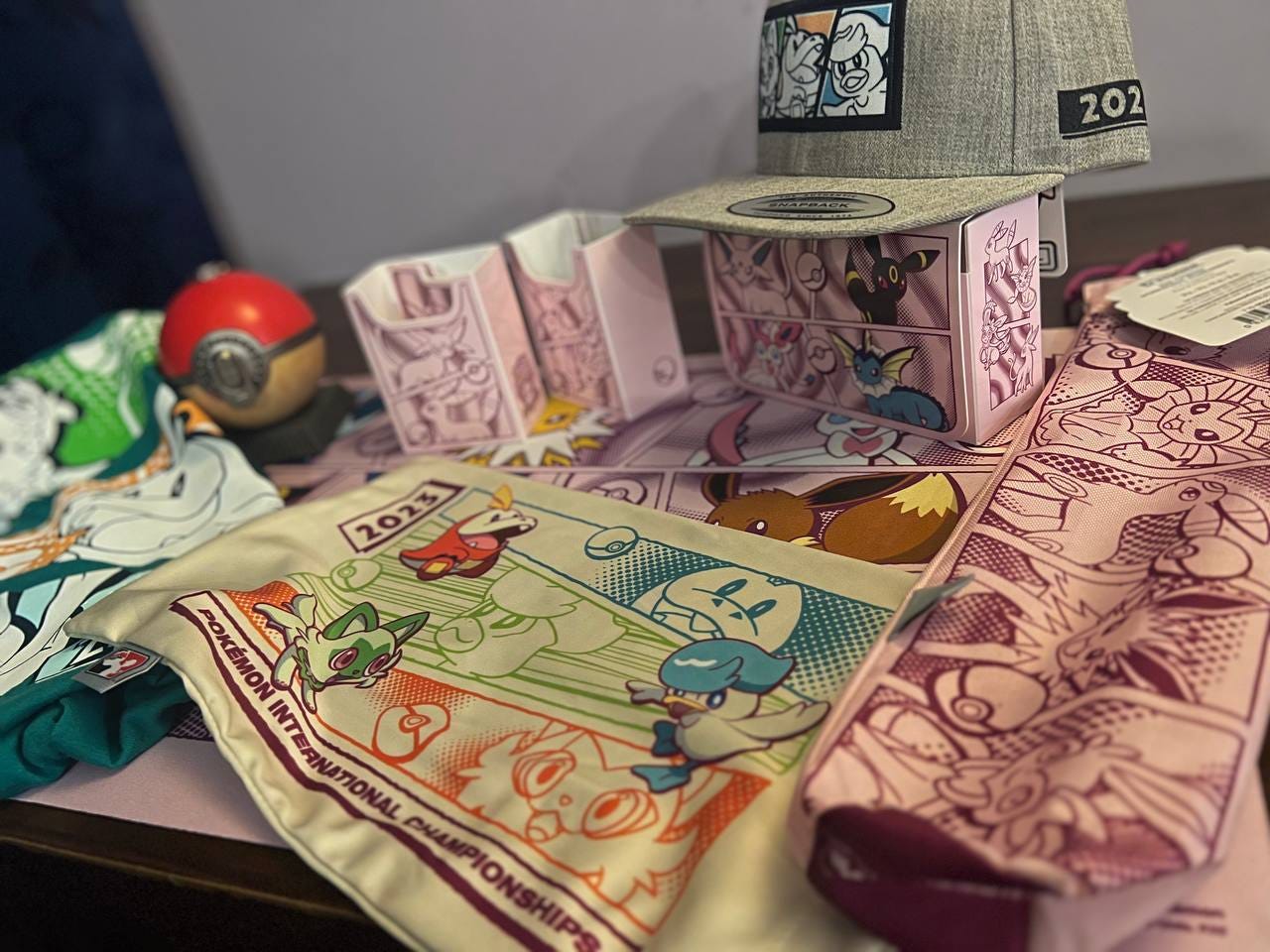 A selection of Pokémn International Championships swag, and items from the Pokémon Center pop-up store