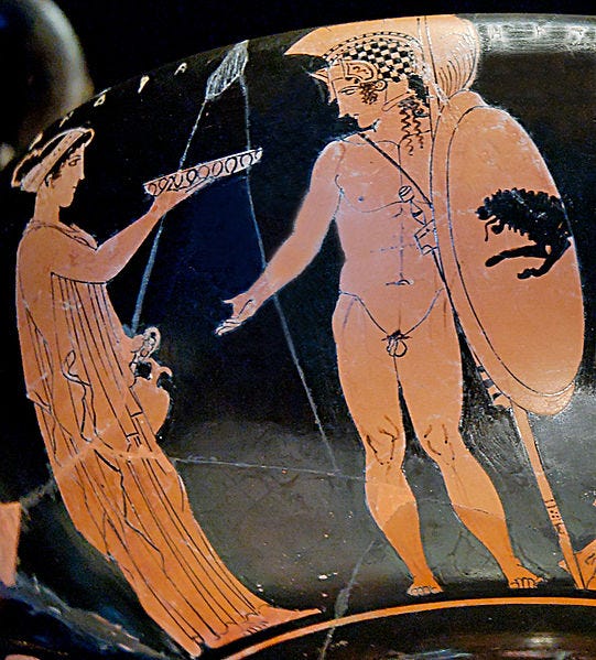 Cassandra (on the left) offering a libation while her brother Hector (on the right) prepares to go to battle. Attic red-figure kantharos by the Eretria Painter, ca. 425–420 BC.