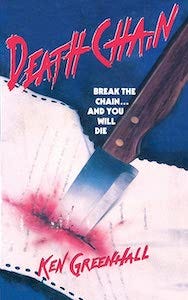 the cover of Deathchain, showing a letter being stabbed with a knife, blood seeping out