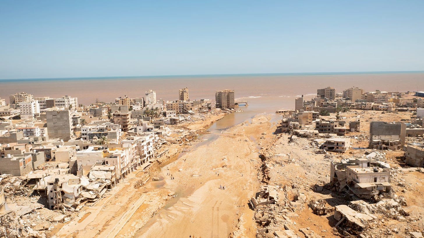 An aerial view the aftermath of the Derna catastrophe with the ocean, where thousands were swept out to sea.