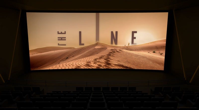 A darkened cinema with a screen showing the opening credits for a movie called The Line. A desert dune with the movie title emerging from behind.