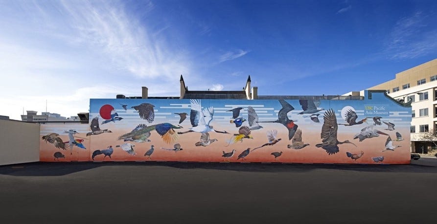 A mural of birds on a wall

Description automatically generated
